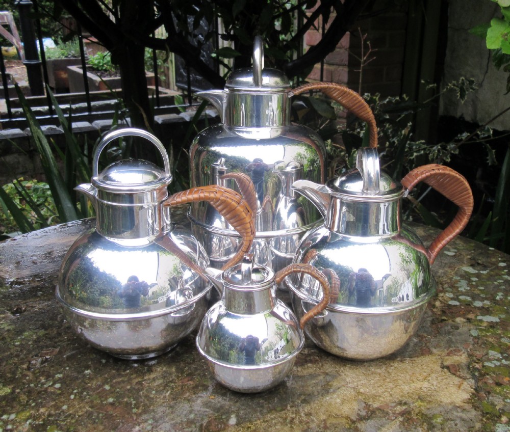 GROUP OF 4 SILVER PLATED GUERNSEY MILK CANS