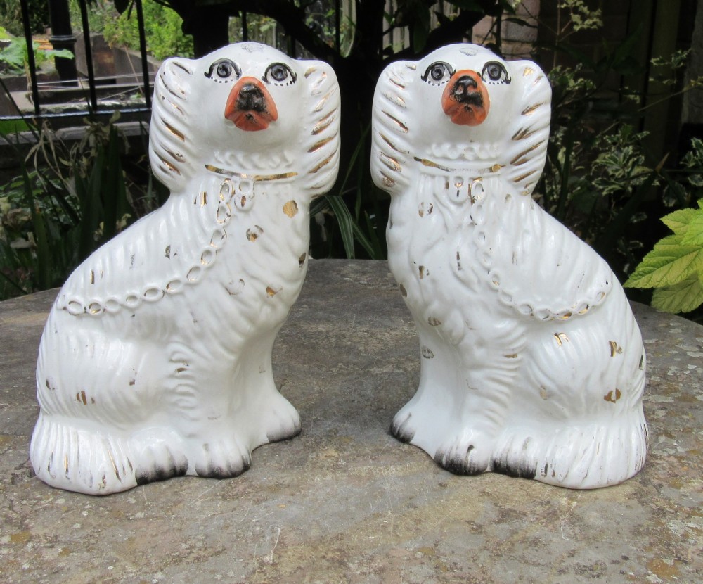 PAIR OF VICTORIAN WHITE & GILT STAFFORDSHIRE DOGS c1880