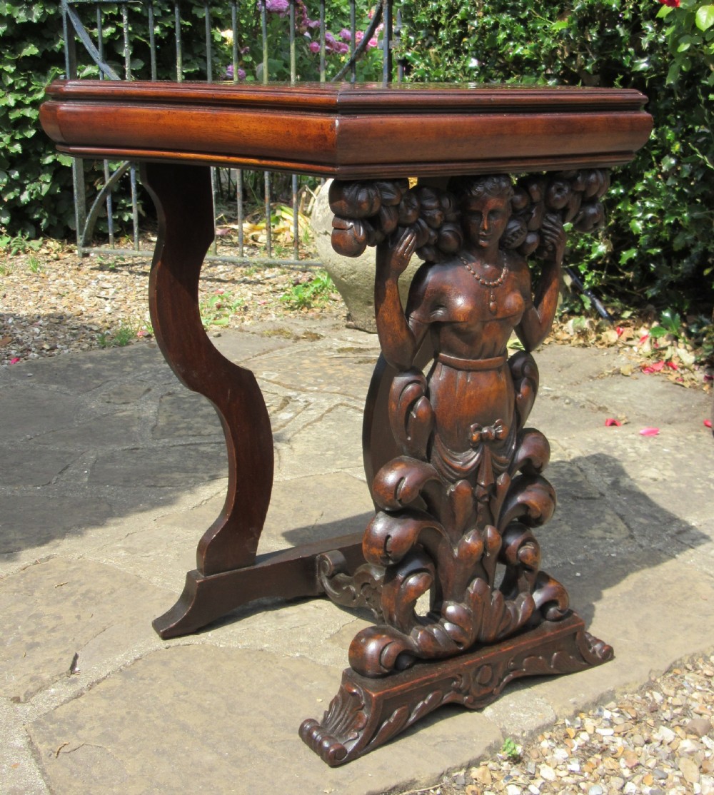 An antique Italian carved walnut pier table featuring a shaped top above a central carved caryatid figure resting on a scrolled base. View IV