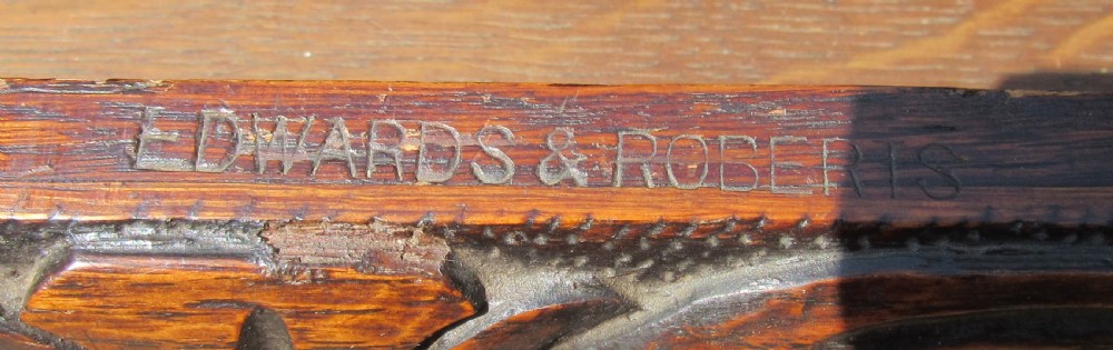 A late 19th-century dark oak writing table featuring relief-carved drawer fronts, barley twist legs, and a double twisted stretcher. View VI