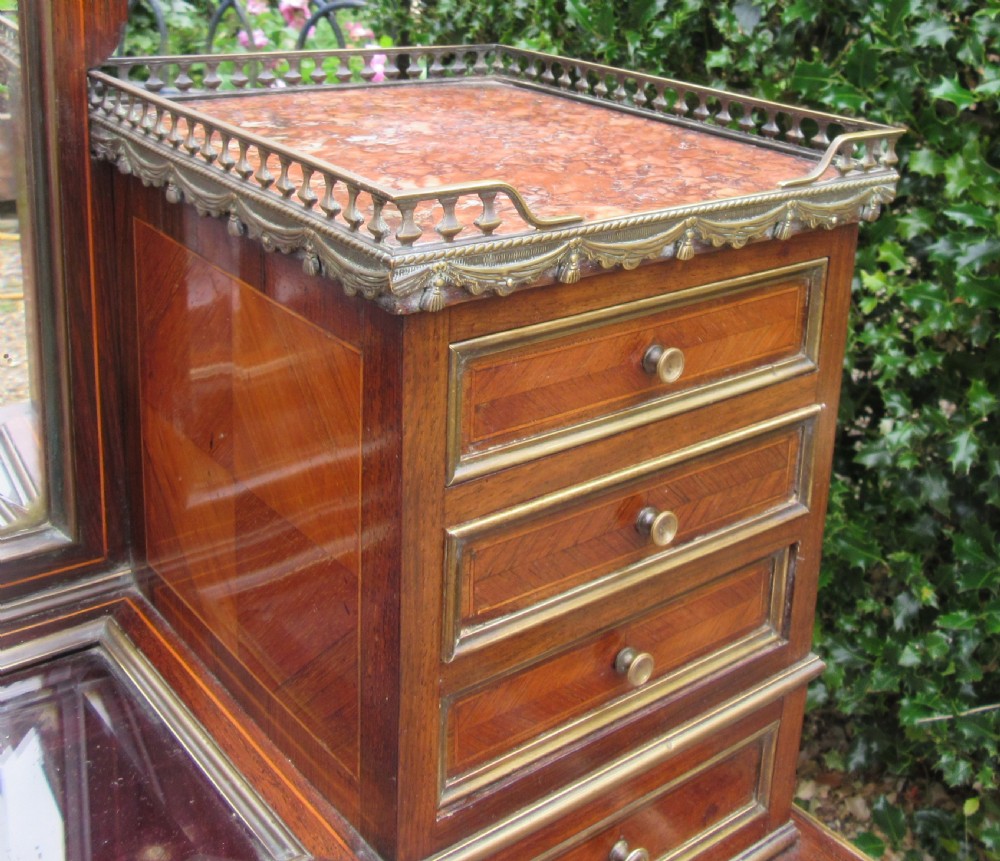 A late 19th-century rosewood bonheur du jour writing desk featuring brass gallery railings, an arched central mirror, multiple small drawers, and tapered legs. View IX