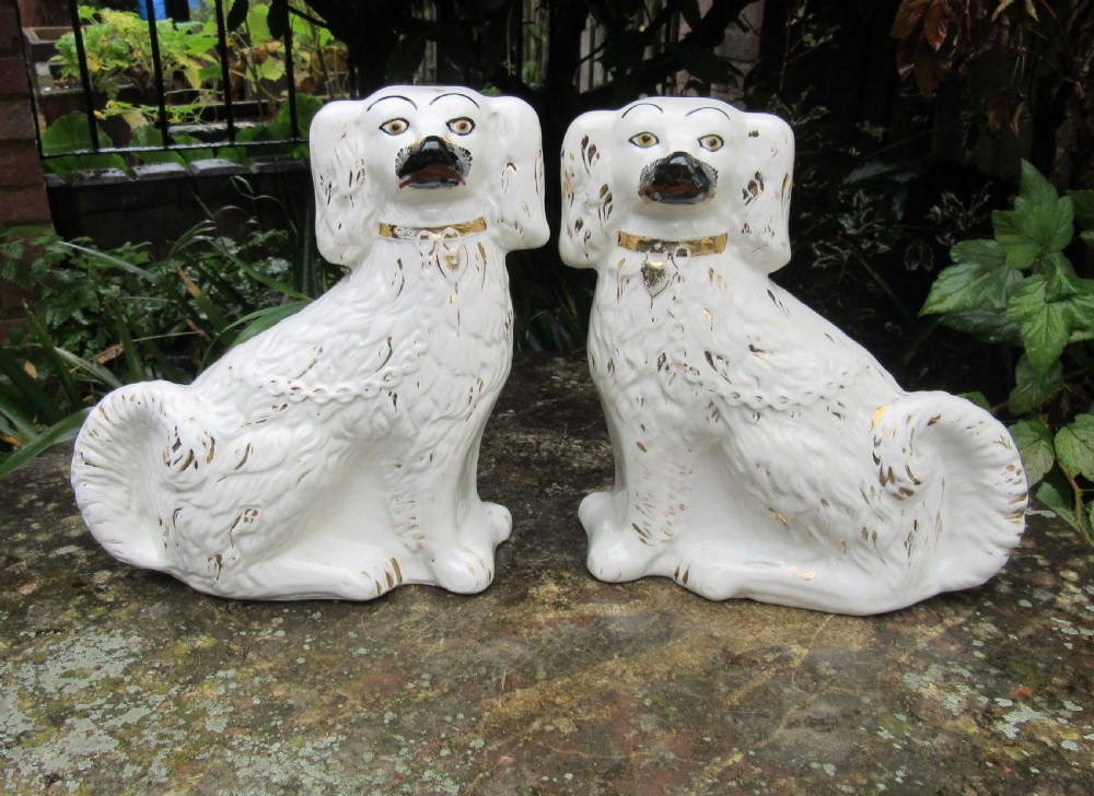 PAIR OF VICTORIAN WHITE & GILT STAFFORDSHIRE DOGS