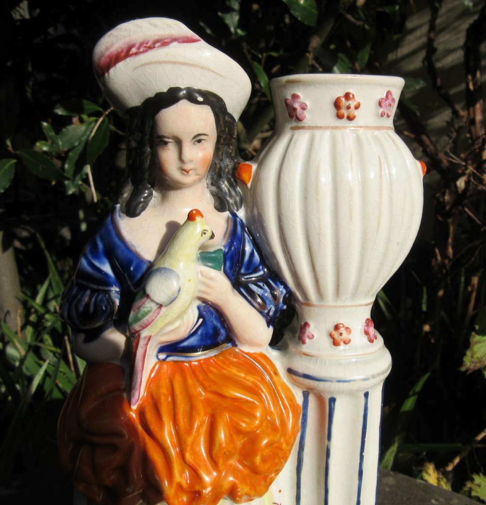 STAFFORDSHIRE FIGURE OF GIRL WITH PARROT BY GARDEN URN View II