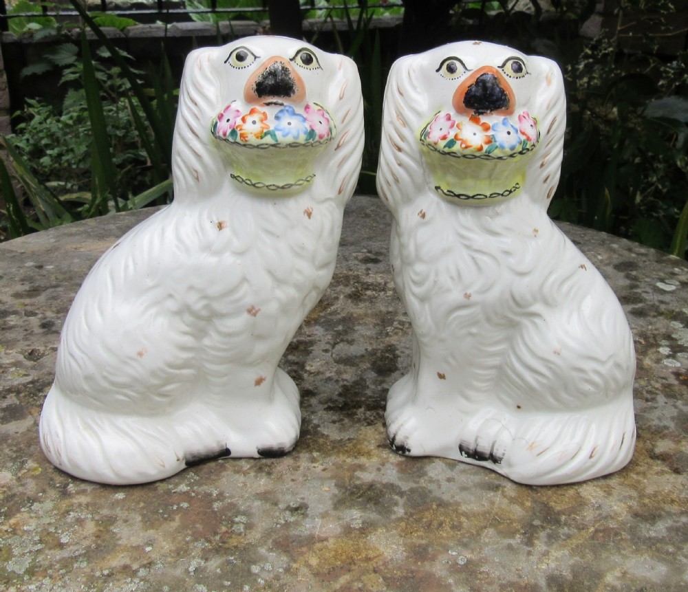 PAIR VICTORIAN STAFFORDSHIRE DOGS WITH BASKETS c1860