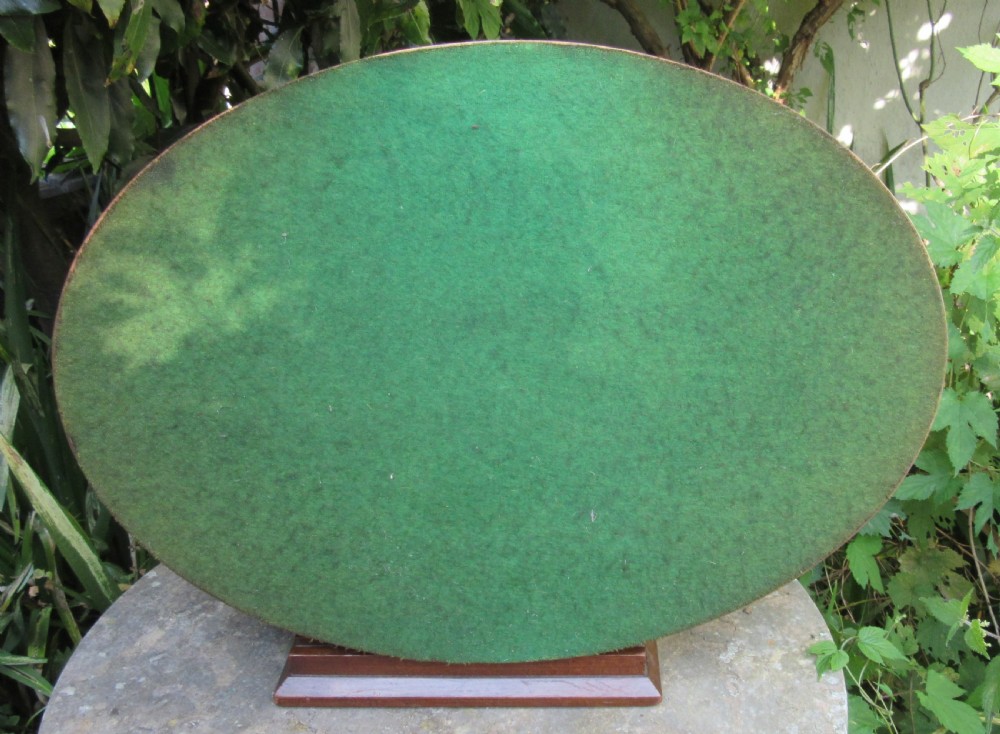 An oval satinwood serving tray featuring detailed central floral marquetry inlay, a pierced brass gallery rim, and two brass handles. View VII