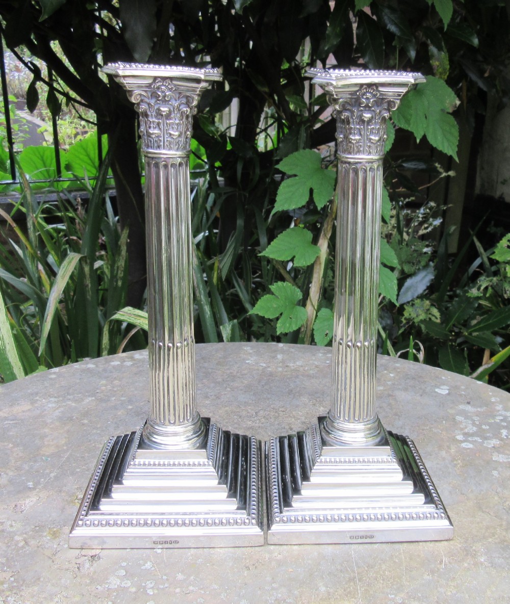 PAIR SILVER PLATED CORINTHIAN COLUMN CANDLESTICKS c1900