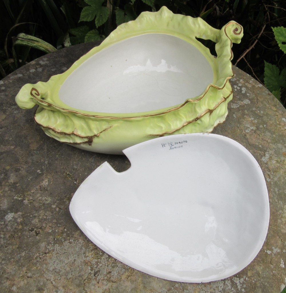 A Victorian Staffordshire ceramic soup tureen with lid, moulded in the shape of cabbage leaves with a pale green wash and gilded leaf rims. View III