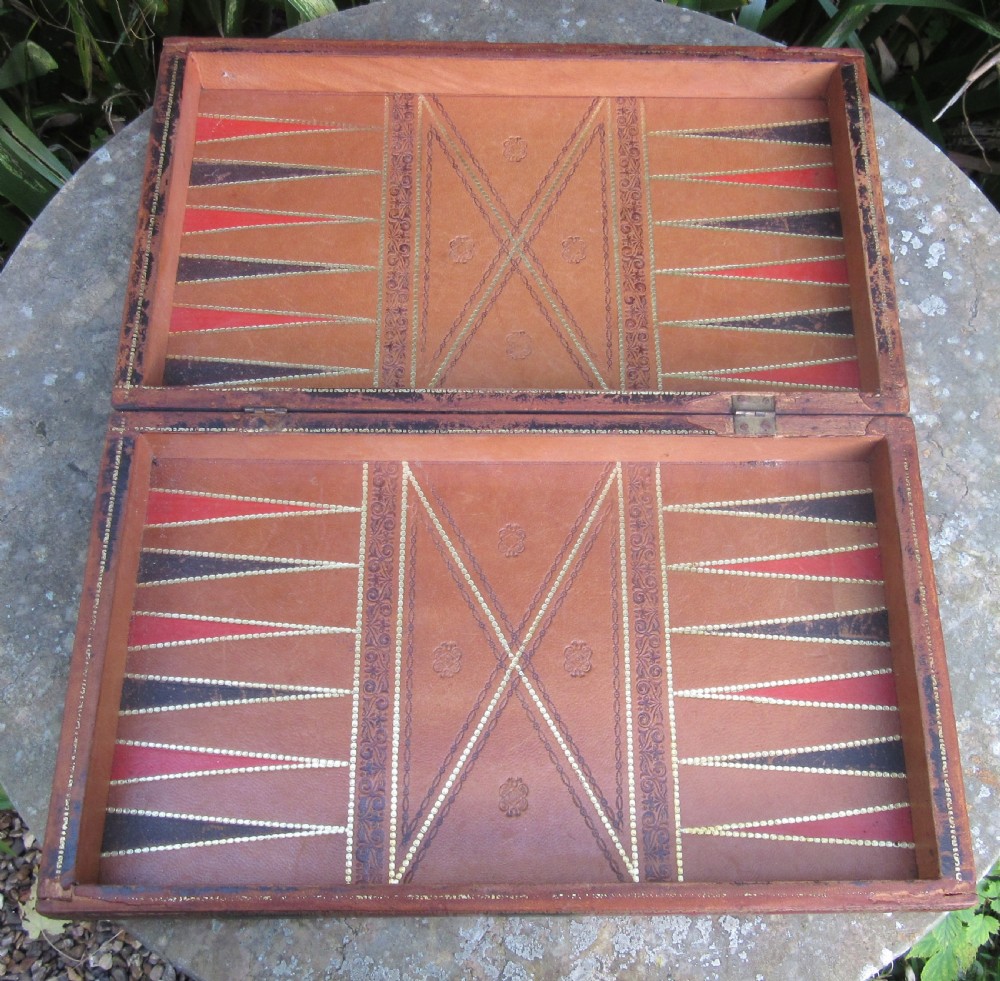 A Victorian folding leather games board designed to resemble two red volumes titled History of Russia with a green and brown chequered surface on top. View IV