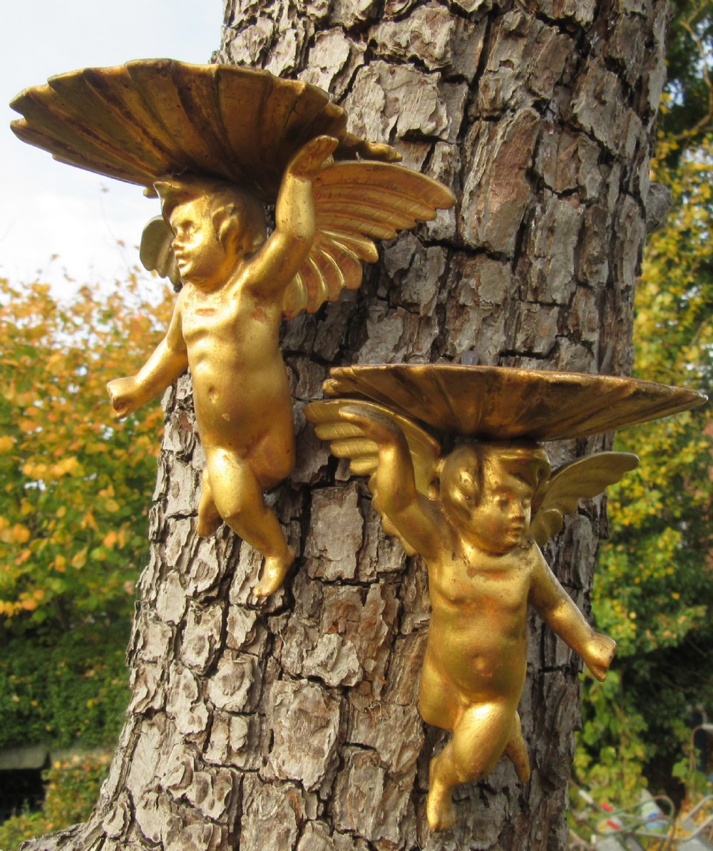 PAIR OF GILDED WOOD CHERUB BRACKETS