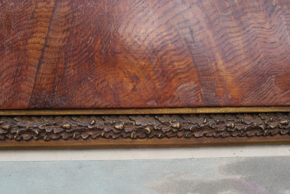 An 1806 engraving depicting figures promenading near the Royal Pavilion in Brighton, set within a wide brown timber frame with a gilded inner rim. View V