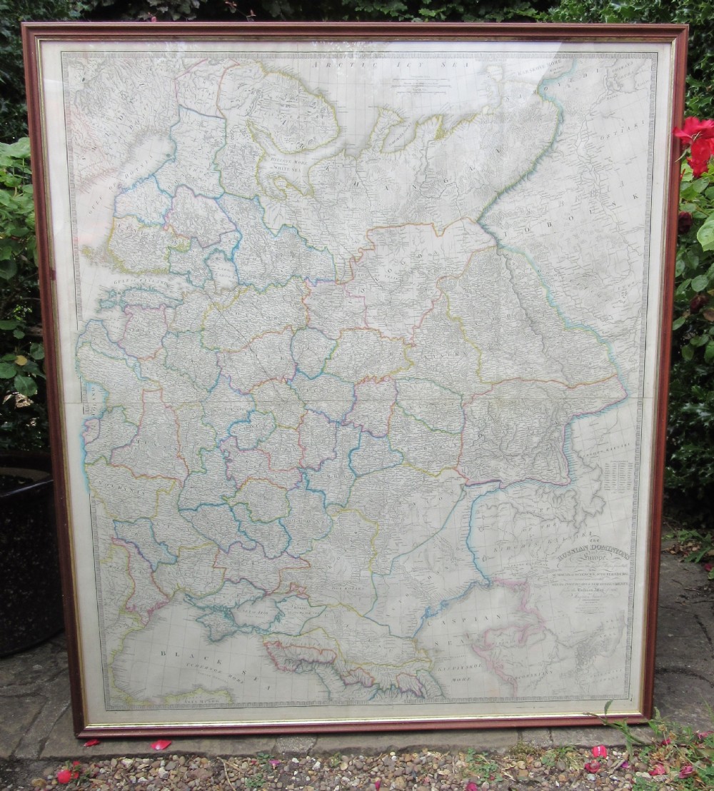 A large framed mid-19th-century map detailing the Russian Dominions in Europe with hand-coloured regional boundary lines.