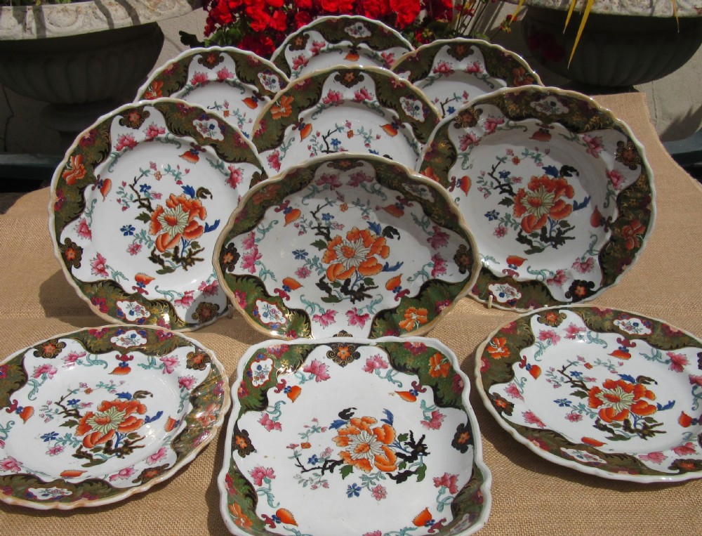 A Regency period Masons Patent Ironstone dessert service featuring hand-painted orange floral patterns and dark green gilded scalloped borders. View II