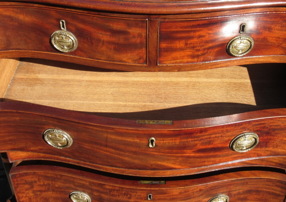 SMALL GEORGE III MAHOGANY SERPENTINE CHEST OF DRAWERS View VII