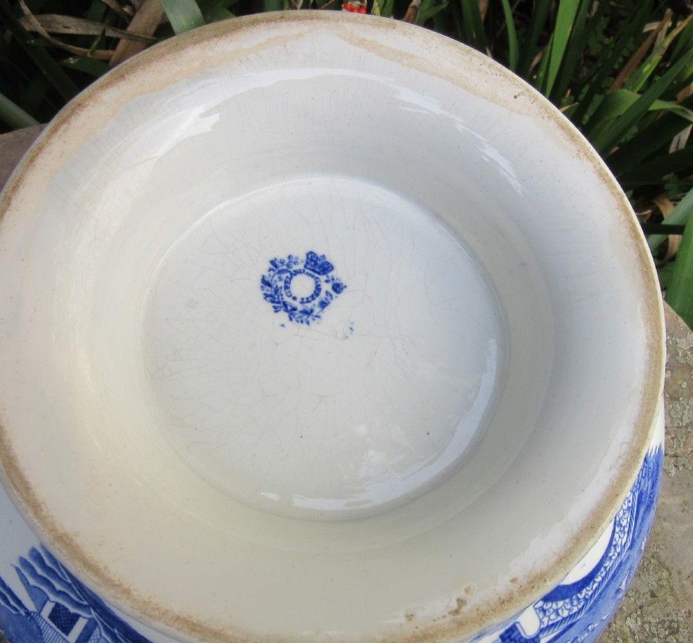 A blue and white transfer-printed ceramic tureen featuring a domed lid, side handles, and a pedestal base decorated with landscape scenes. View V