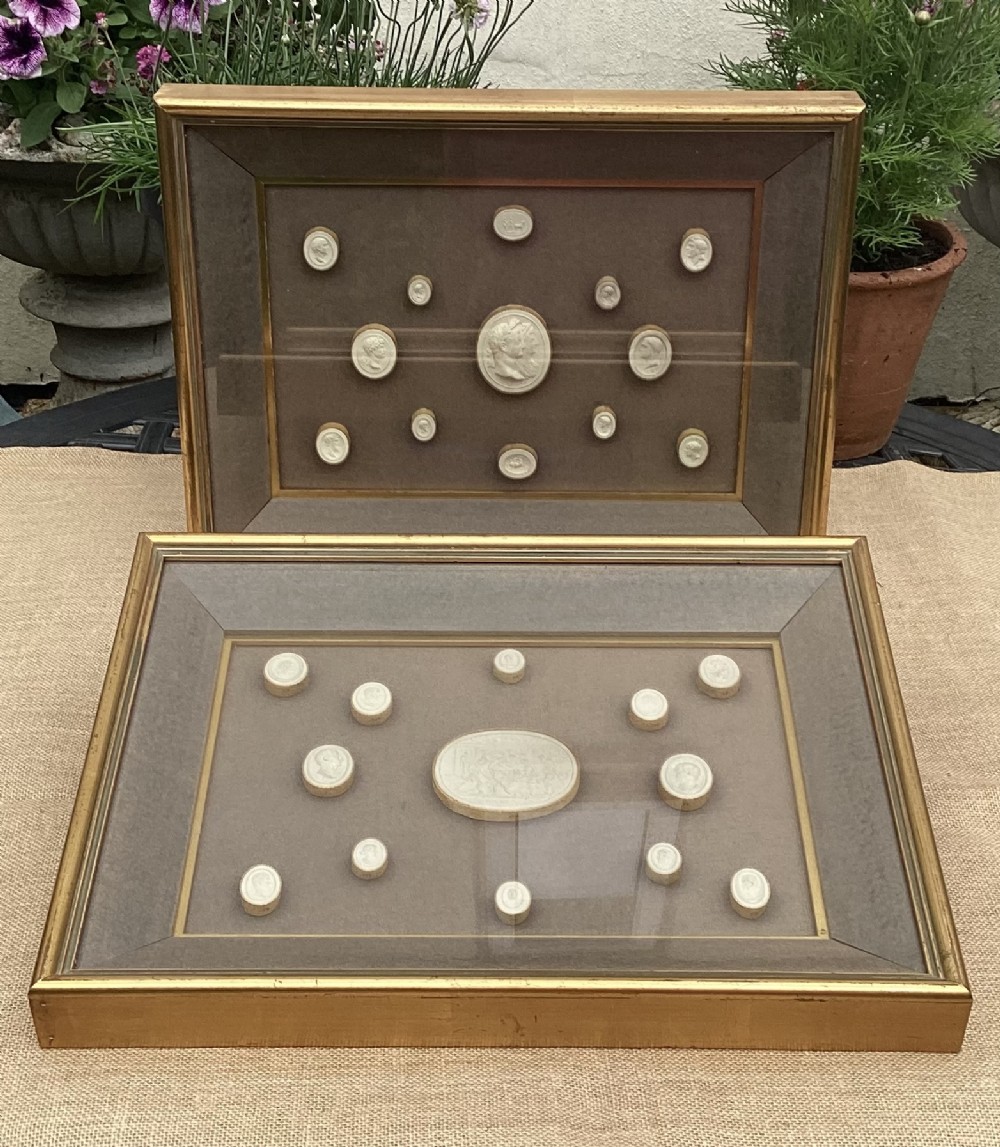 PAIR GILT CASED PLASTER INTAGLIO DISPLAYS c1860
