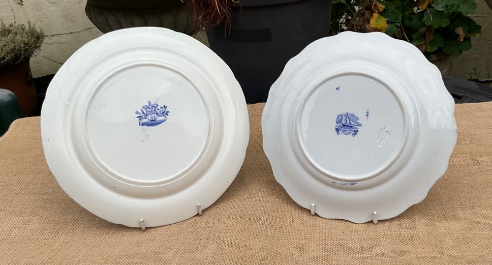 A group of six early 19th-century Staffordshire blue and white transferware ceramic plates displaying pastoral, coastal, and floral patterns with scalloped borders. View VII