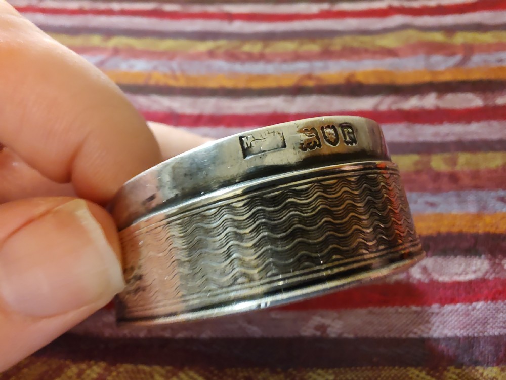 An oval Edwardian silver snuff box with an engraved dot pattern along the edge of the lid. View XIV
