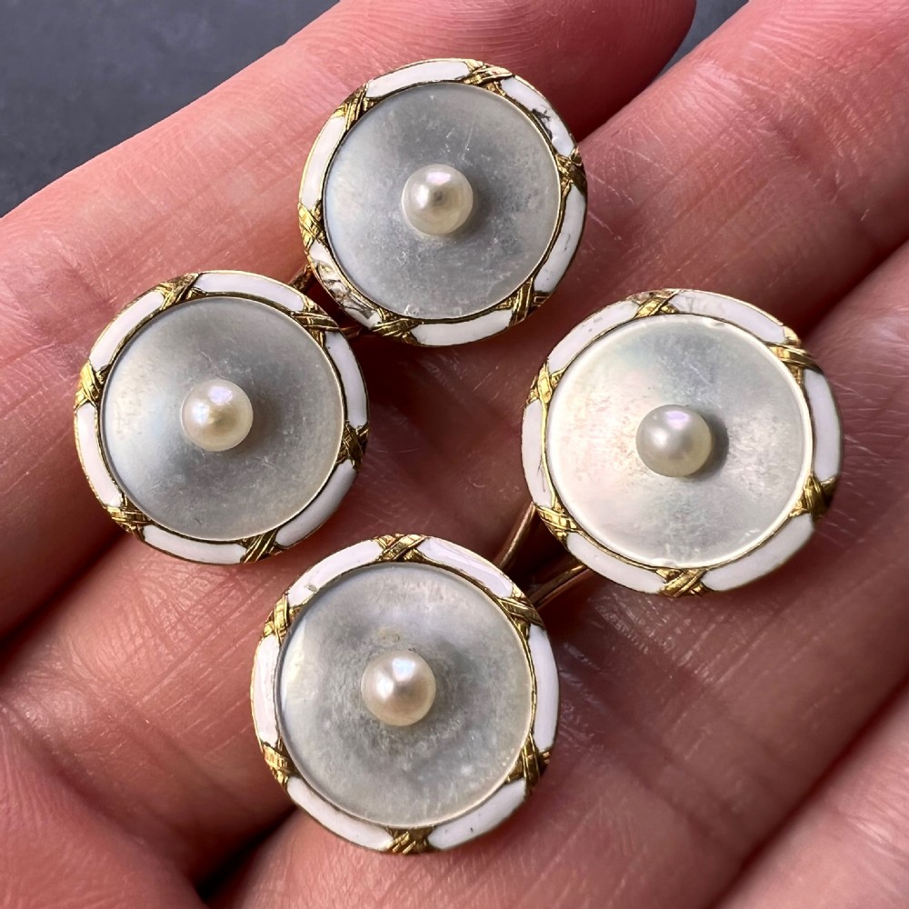A set of double-sided French 18K yellow gold cufflinks with circular mother-of-pearl faces, central pearls, and white enamel borders. View XI
