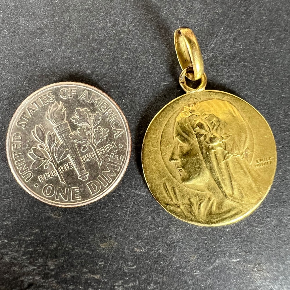 A circular 18k yellow gold pendant featuring a relief profile portrait of the Virgin Mary signed by Emile Monier. View XI