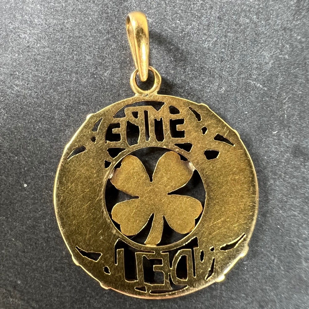 A circular antique 18-carat yellow gold openwork pendant featuring a four-leaf clover framed by the Latin inscription Semper Fidelis. View III