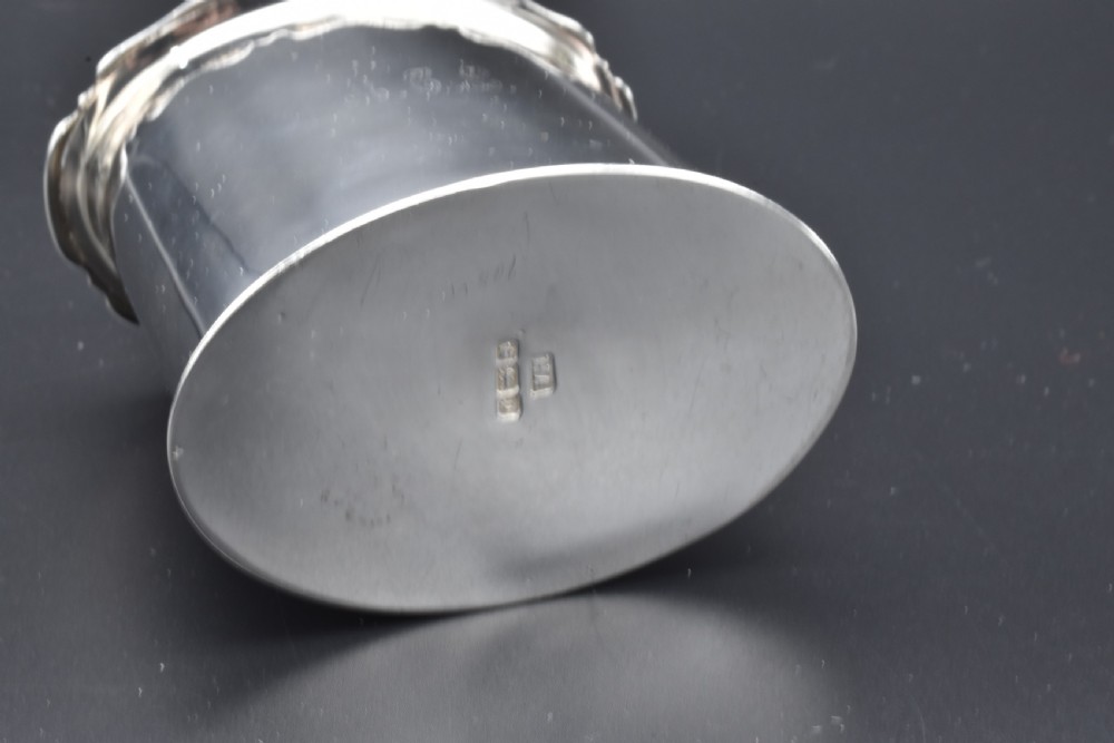 A cylindrical Edwardian sterling silver tea caddy with a scalloped edge lid and an engraved monogram on the front. View VI