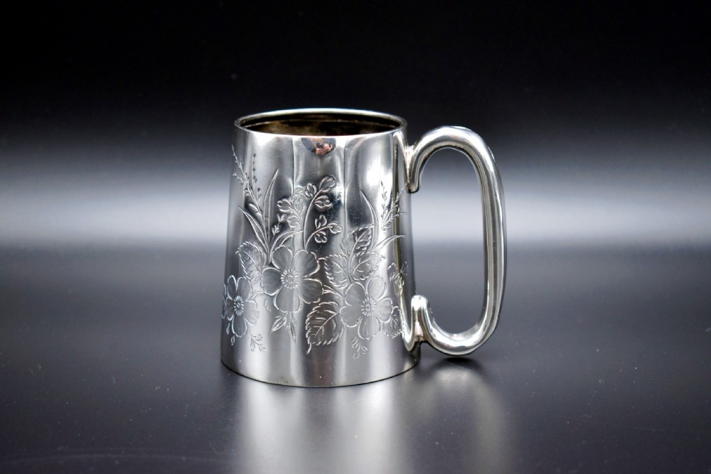 A late Victorian sterling silver tankard featuring etched floral motifs and British hallmarks near the top rim. View III