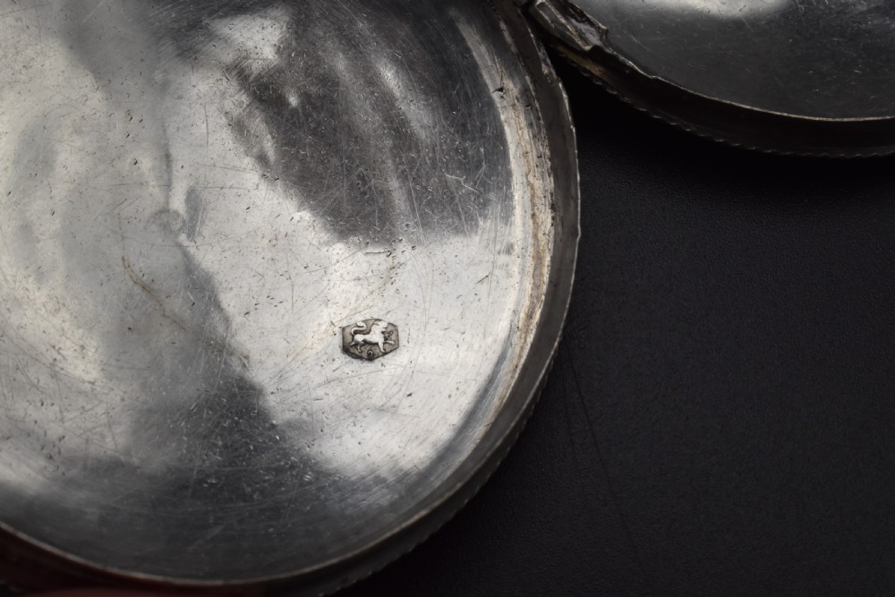 A circular 19th-century Dutch sterling silver snuff box featuring concentric engine-turned engraving and reeded borders. View VII