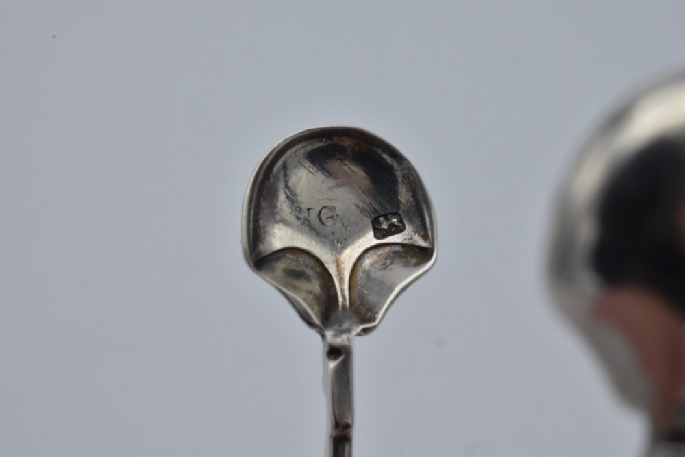 An 18th-century Georgian sterling silver scissor-form sugar nip with curved scroll handles and shell-shaped grips. View VI