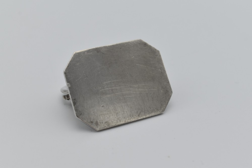 A sterling silver menu holder shaped like a naval crown mounted on an octagonal silver base. View VII