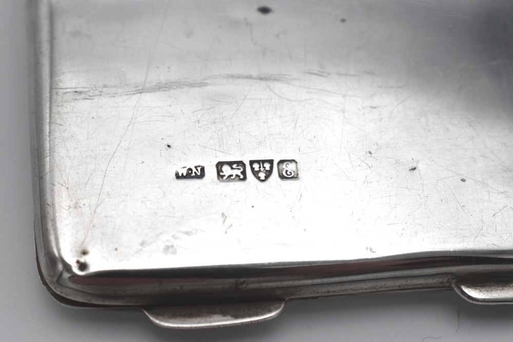 A rectangular sterling silver aide-memoire card case featuring a central hand-engraved cursive monogram M and hallmarks on the lower left corner. View IV