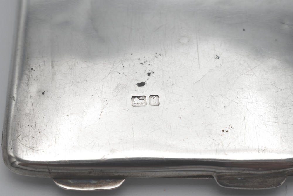 A rectangular sterling silver aide-memoire card case featuring a central hand-engraved cursive monogram M and hallmarks on the lower left corner. View V
