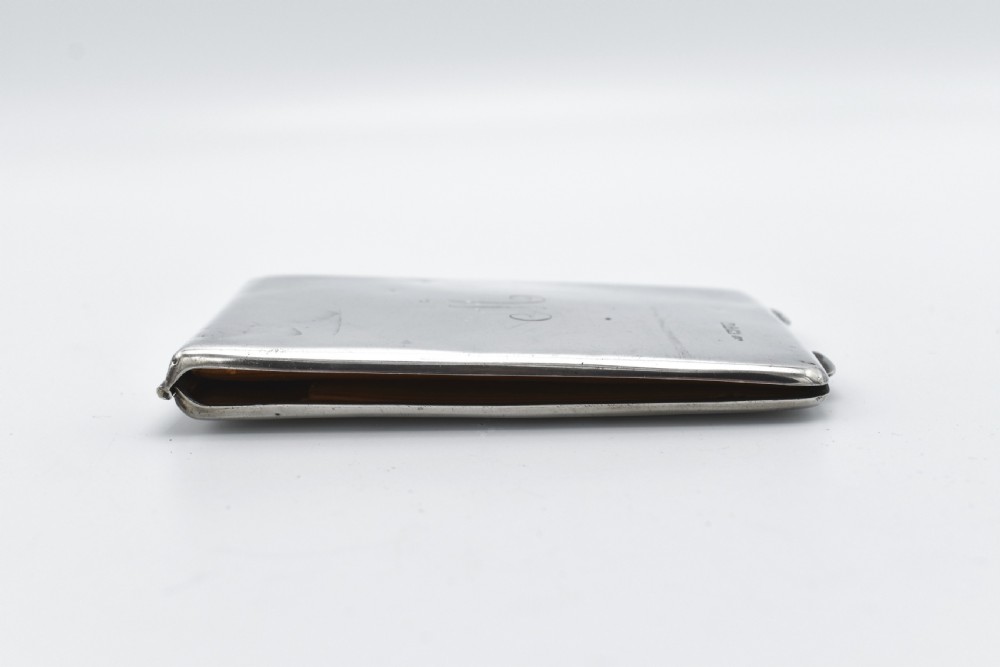 A rectangular sterling silver aide-memoire card case featuring a central hand-engraved cursive monogram M and hallmarks on the lower left corner. View VI
