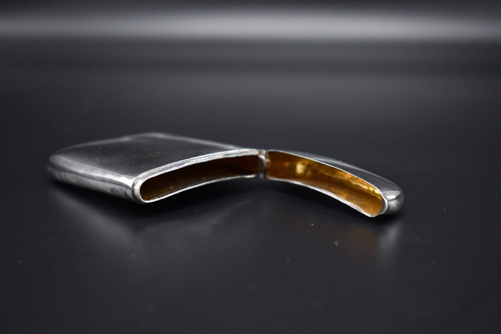 A polished Victorian sterling silver pocket card case with a hinged lid displayed on a dark background. View VI