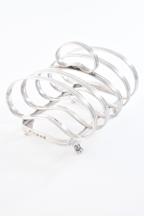 fig 3. Sterling Silver Four Slice Toast Rack 1934