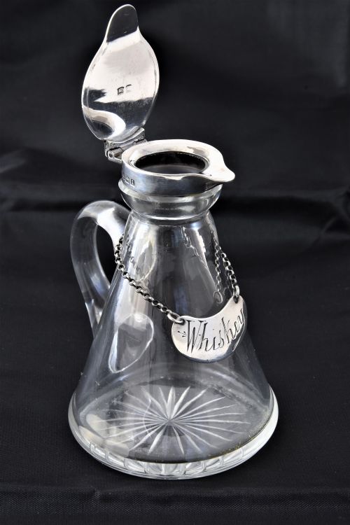 fig 2. Silver Mounted Whisky Noggin with Silver Label 1910