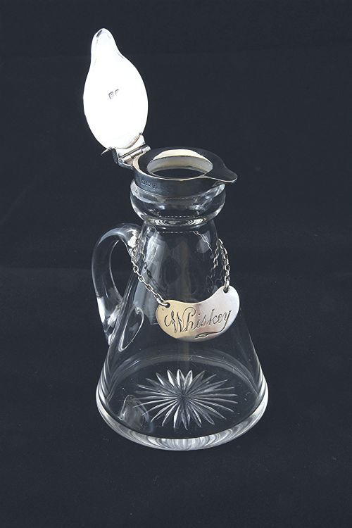 fig 2. Silver Mounted Whisky Noggin with Silver Label 1911