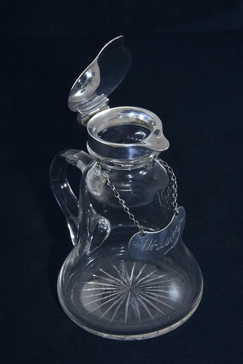 fig 2. Silver Mounted Whisky Noggin with Silver Label 1911