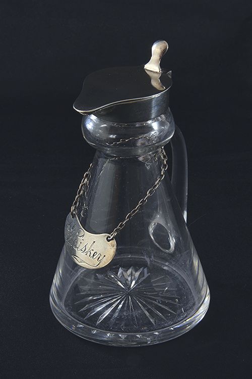 fig 1. Silver Mounted Whisky Noggin & Label 1935