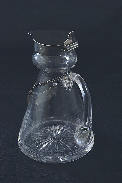 fig 2. Silver Mounted Whisky Noggin & Label 1935
