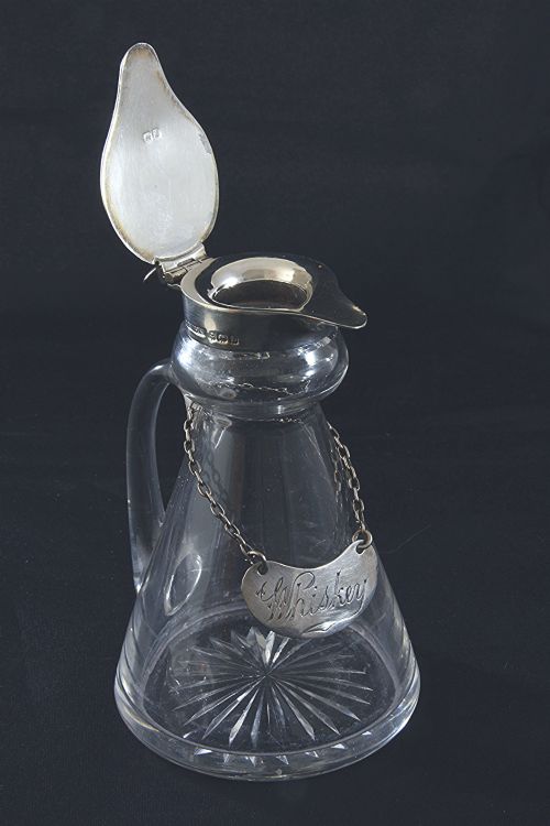 fig 4. Silver Mounted Whisky Noggin & Label 1935