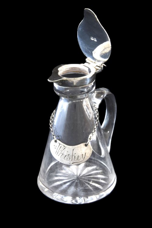fig 4. Silver Mounted Whisky Noggin & Label 1917