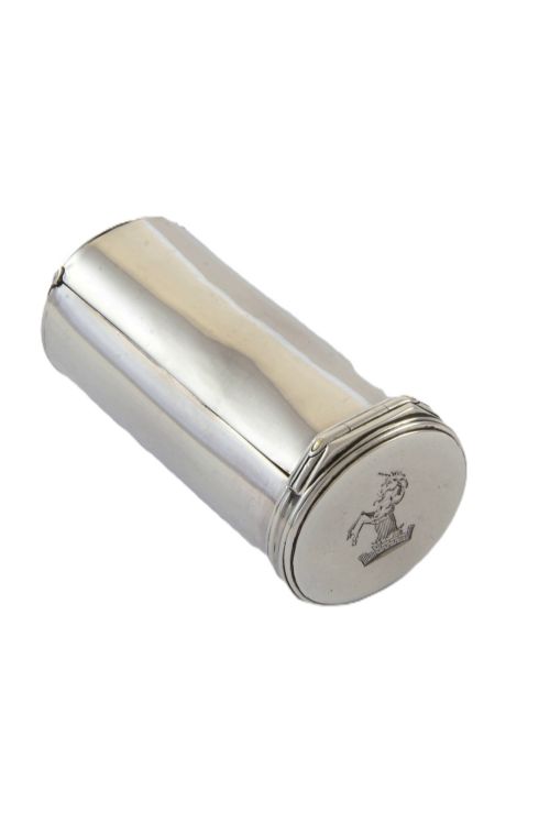 fig 1. A cylindrical silver nutmeg grater from 1796 featuring an engraved heraldic crest of a unicorn on the lid.