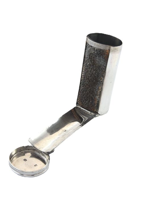 fig 2. A cylindrical silver nutmeg grater from 1796 featuring an engraved heraldic crest of a unicorn on the lid.