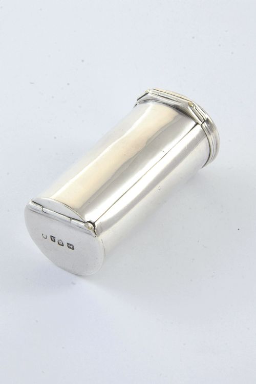 fig 3. A cylindrical silver nutmeg grater from 1796 featuring an engraved heraldic crest of a unicorn on the lid.