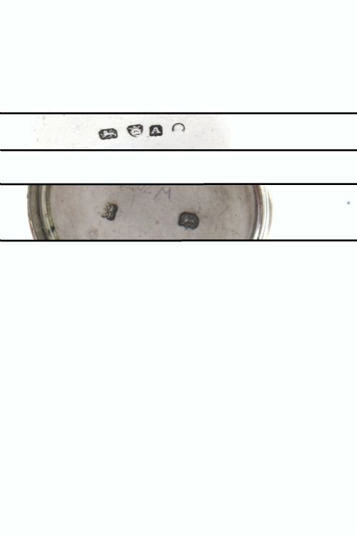 fig 4. A cylindrical silver nutmeg grater from 1796 featuring an engraved heraldic crest of a unicorn on the lid.