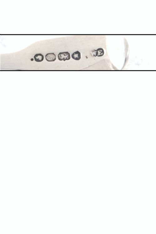 fig 3. An early Victorian sterling silver caddy spoon featuring a fluted shell-shaped bowl and a plain handle.