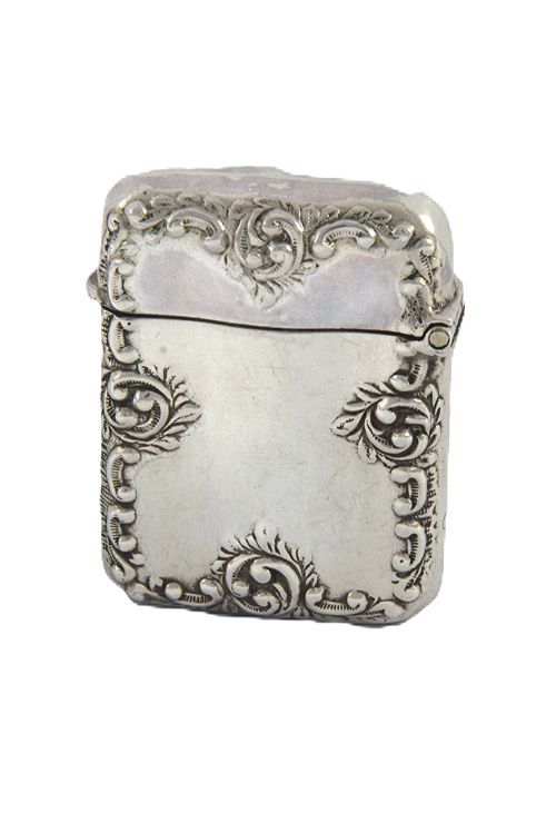 fig 1. A late Victorian sterling silver rectangular vesta case featuring embossed scrollwork decoration and a hinged lid.