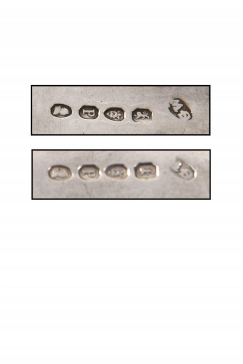 fig 3. A pair of 1810 Georgian sterling silver berry spoons featuring engraved handles and gilded, repousse bowls embossed with fruit designs.