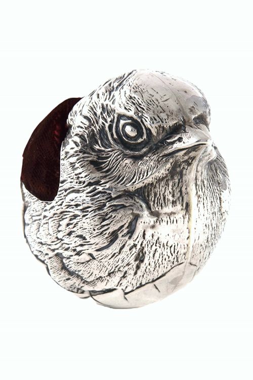 fig 1. An antique sterling silver pin cushion modelled in the realistic form of a chick with detailed feather engraving and a deep burgundy velvet cushion insert.