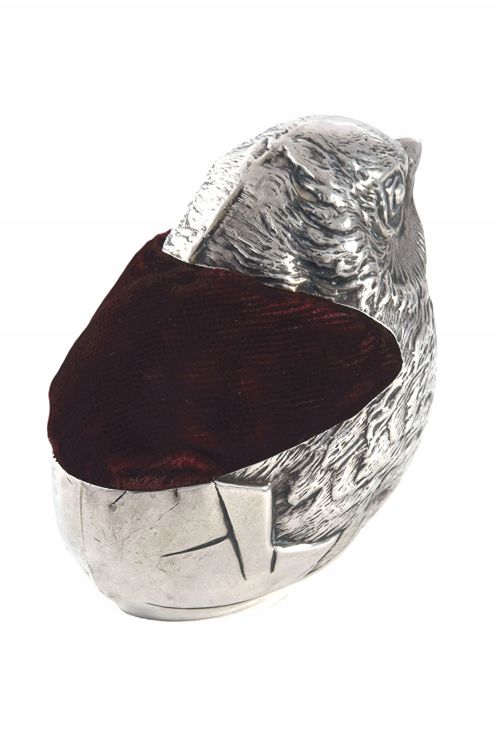 fig 2. An antique sterling silver pin cushion modelled in the realistic form of a chick with detailed feather engraving and a deep burgundy velvet cushion insert.